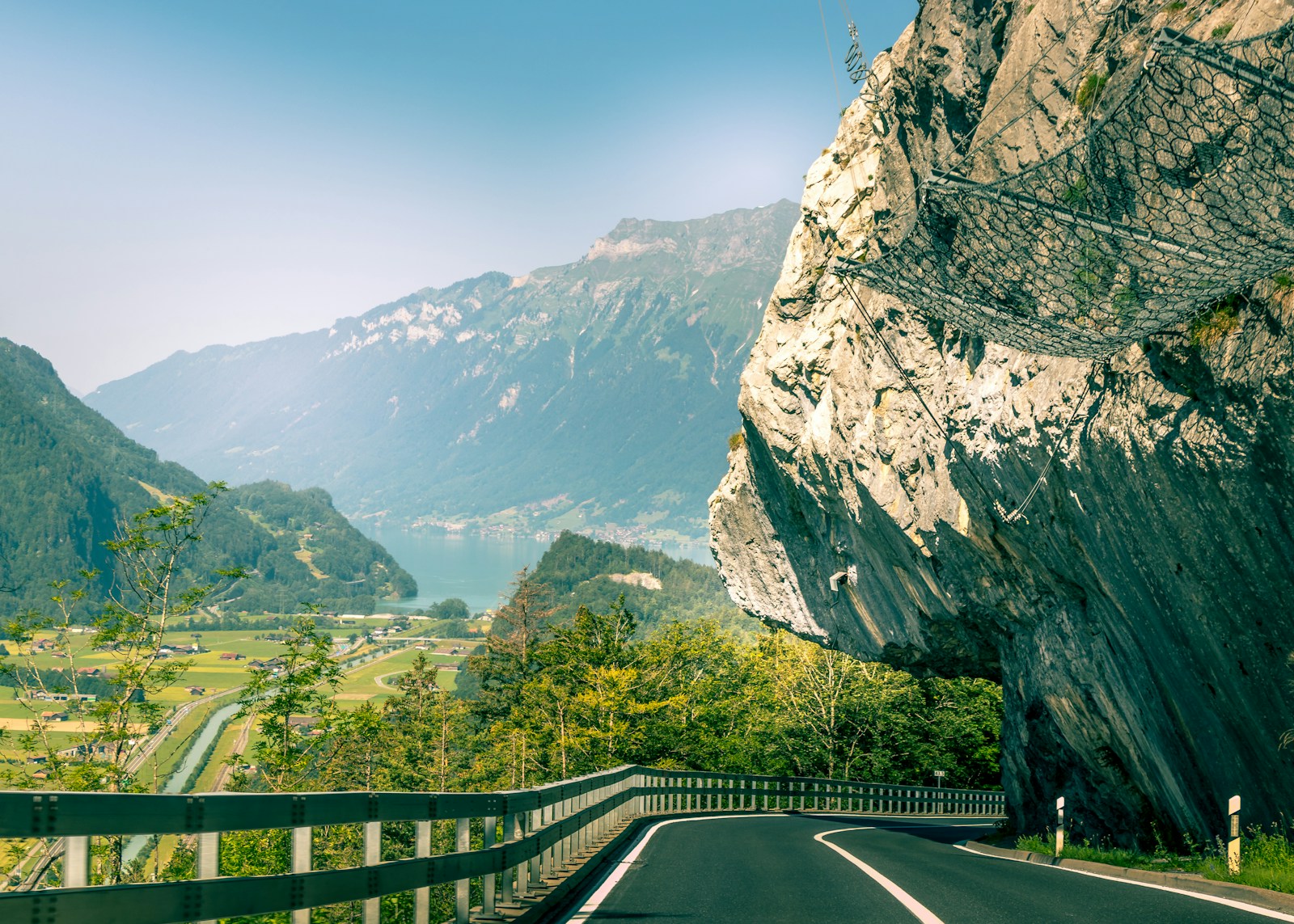 gray asphalt road under blue sky